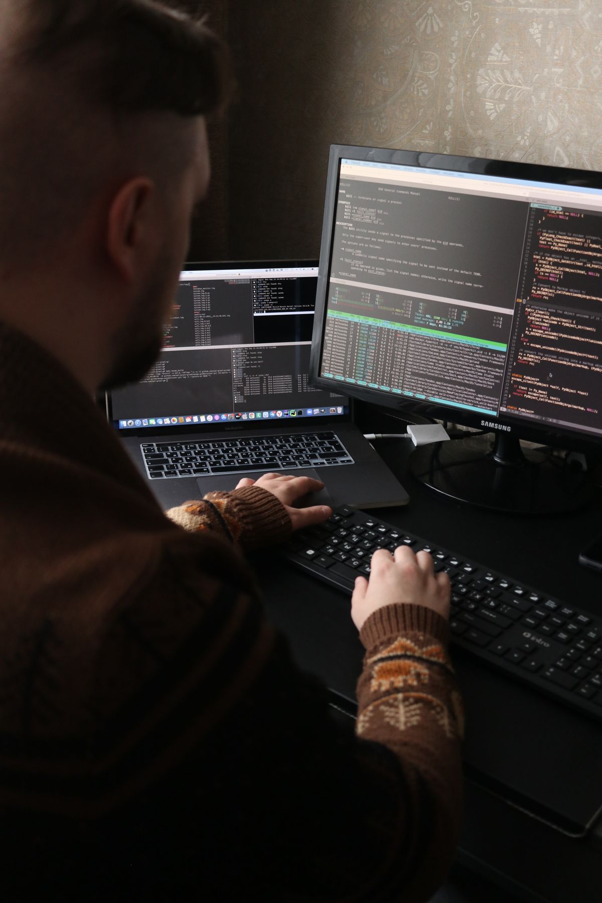Engineer working across terminals and dashboards